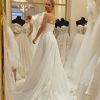Buy Sell Wedding Dress Online Dubaie UAE BrandNew white A-Line gown by Ukrainian designer Vintage with straight across neckline. Sizer Small- Medium