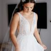 Buy sell wedding dress online Dubai UAE Jessica Couture A-Line Gown with V-neckline. Made of offwhite Dentelle fabric. Size Small.